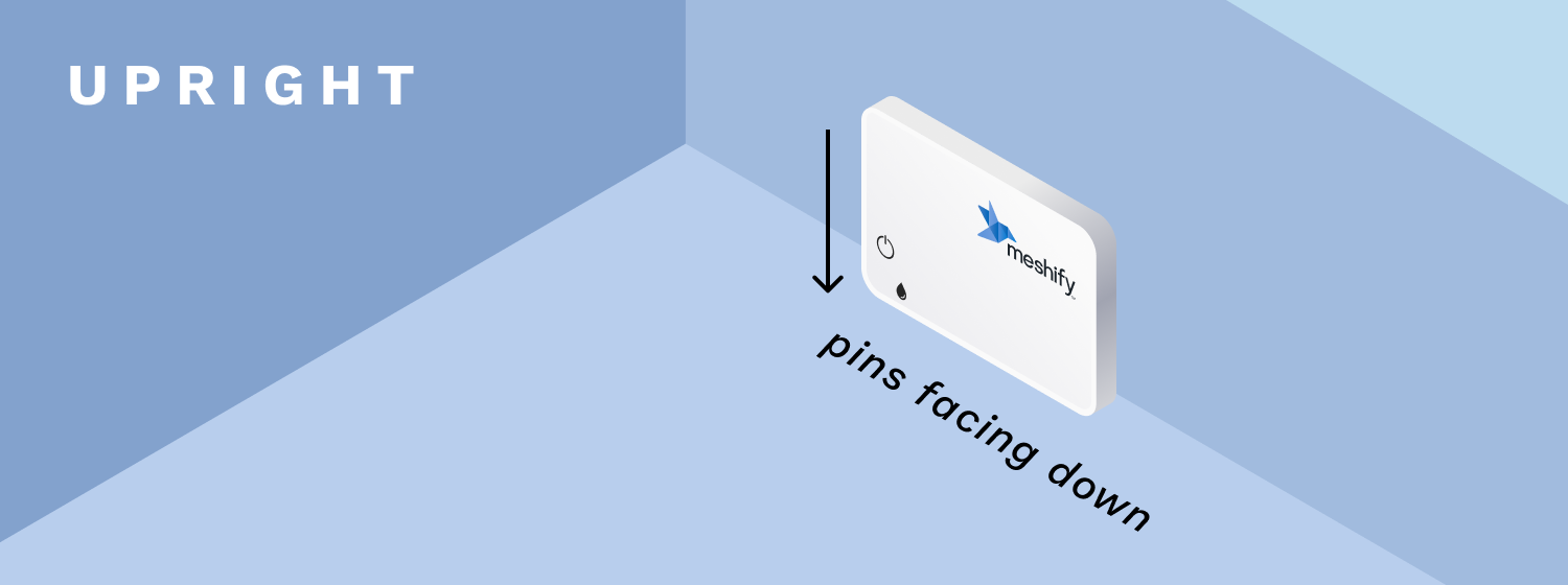 An illustration of the Defender Slim sensor being placed upright against the wall with the sensor's pins facing down to the ground.